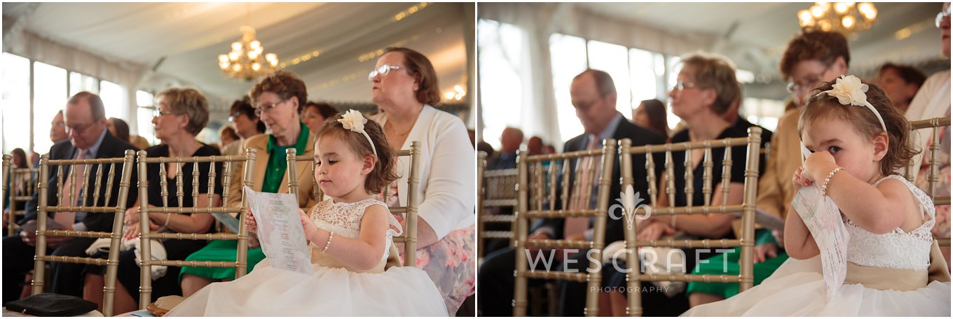 The flower girl follows along in the program and then decides to play peek-a-boo with the photographer.